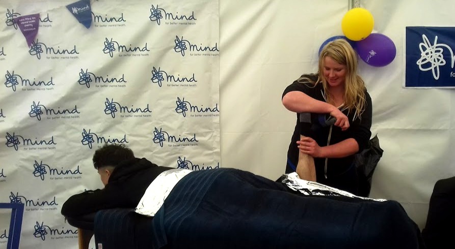 Louisa treating a client at a Mind charity event.